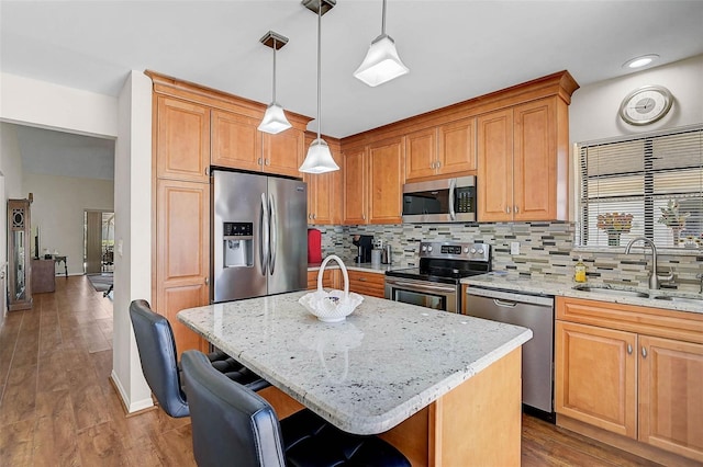 7817 Pine Trace Dr Unit 15, Sarasota, FL 34243 - kitchen with a sink, appliances with stainless steel finishes, backsplash, and light stone counters