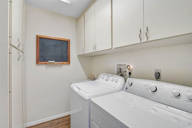 7817 Pine Trace Dr Unit 15, Sarasota, FL 34243 - laundry area featuring baseboards, wood finished floors, cabinet space, and washer and dryer