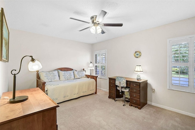 7817 Pine Trace Dr Unit 15, Sarasota, FL 34243 - bedroom with carpet flooring, baseboards, and ceiling fan