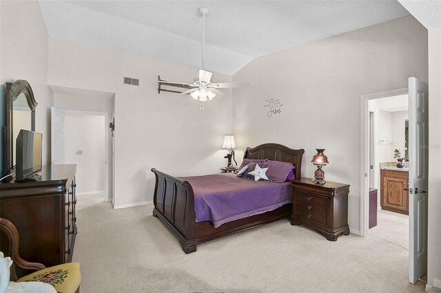 7817 Pine Trace Dr Unit 15, Sarasota, FL 34243 - bedroom with light colored carpet, baseboards, ensuite bathroom, lofted ceiling, and visible vents