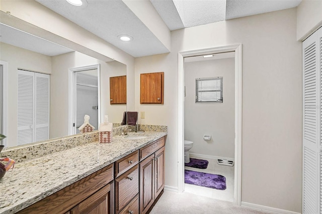 7817 Pine Trace Dr Unit 15, Sarasota, FL 34243 - full bathroom with vanity, toilet, recessed lighting, baseboards, and a closet