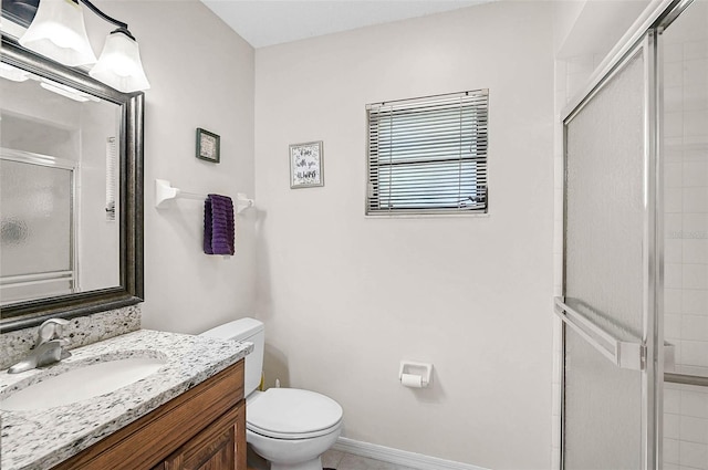 7817 Pine Trace Dr Unit 15, Sarasota, FL 34243 - full bathroom featuring vanity, baseboards, toilet, and a shower stall