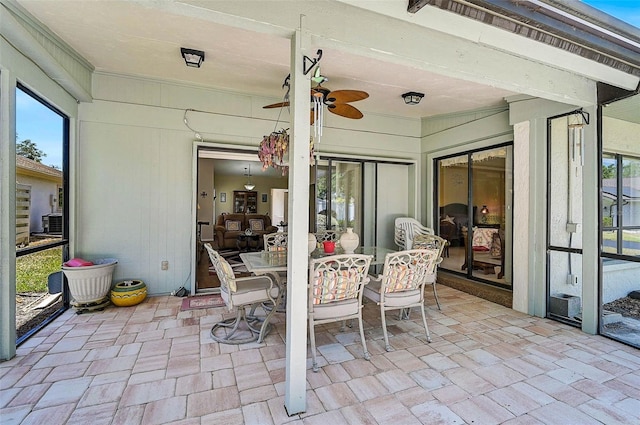 7817 Pine Trace Dr Unit 15, Sarasota, FL 34243 - view of patio with a ceiling fan and outdoor dining area