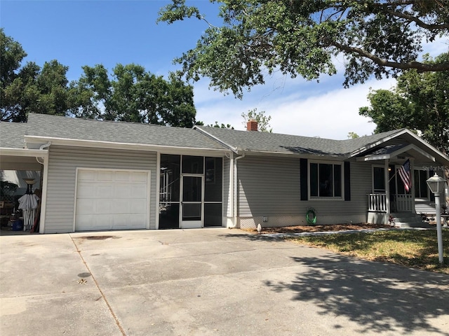 2547 Prospect St, Sarasota, FL 34239 - single story home featuring a garage, a shingled roof, a chimney, and driveway