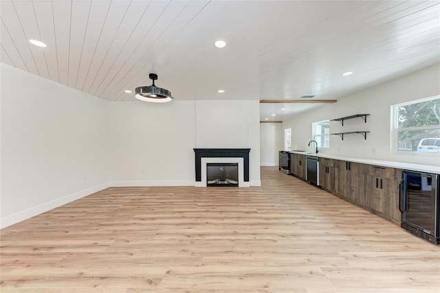 1016 38th St W, Bradenton, FL 34205 - unfurnished living room with beverage cooler, recessed lighting, wooden ceiling, and light wood-style flooring