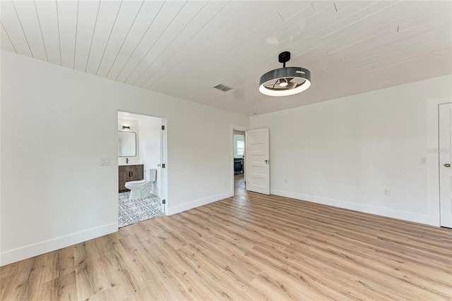 1016 38th St W, Bradenton, FL 34205 - empty room with baseboards, visible vents, wood ceiling, and light wood-style floors
