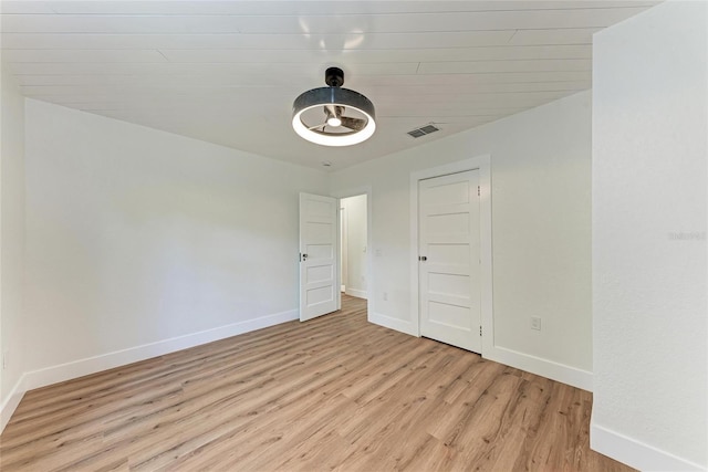 1016 38th St W, Bradenton, FL 34205 - unfurnished room with visible vents, light wood-style floors, and baseboards