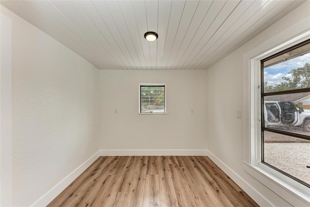 1016 38th St W, Bradenton, FL 34205 - spare room featuring baseboards, wooden ceiling, and light wood-style floors