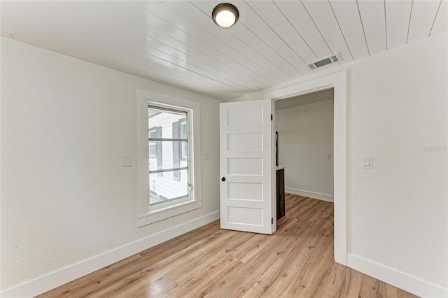 1016 38th St W, Bradenton, FL 34205 - unfurnished room with baseboards, wood ceiling, light wood-type flooring, and visible vents