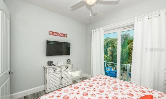 bedroom featuring baseboards, wood finished floors, access to outside, and ceiling fan