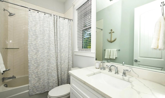 full bath with toilet, shower / bath combo, and vanity
