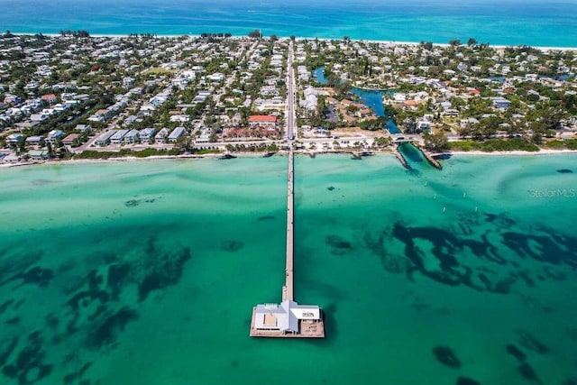 aerial perspective of suburban area with a large body of water