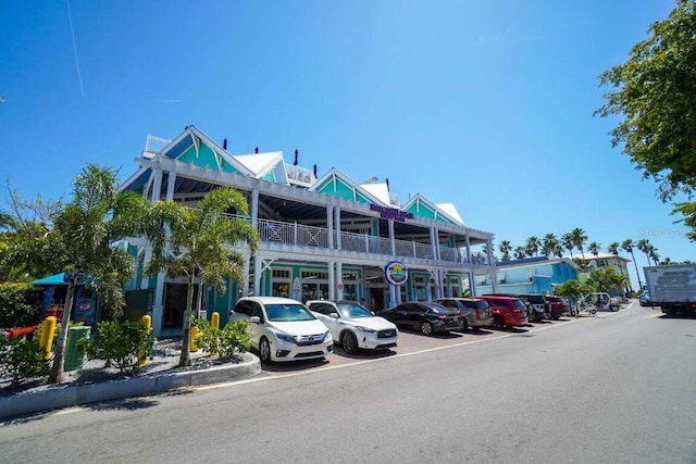 view of property featuring uncovered parking