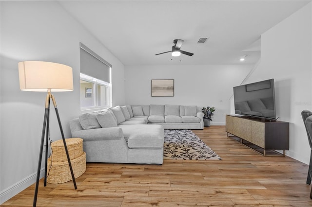 11430 Gallatin Trl, Parrish, FL 34219 - living area featuring a ceiling fan, light wood-style flooring, and baseboards