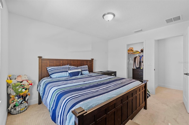 11430 Gallatin Trl, Parrish, FL 34219 - bedroom featuring light carpet, a spacious closet, baseboards, and a closet