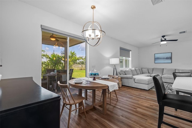 11430 Gallatin Trl, Parrish, FL 34219 - dining room featuring ceiling fan, wood finished floors, and a chandelier
