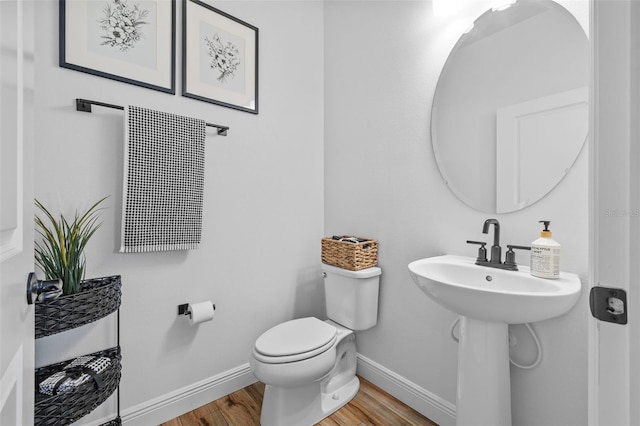 11430 Gallatin Trl, Parrish, FL 34219 - half bath featuring wood finished floors, baseboards, and toilet