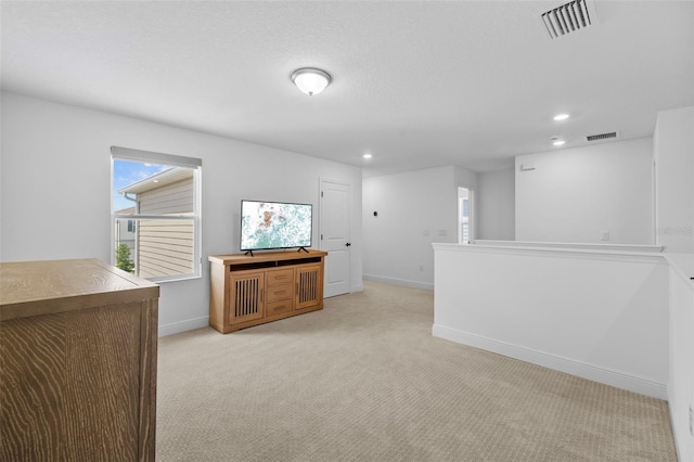 11430 Gallatin Trl, Parrish, FL 34219 - unfurnished living room featuring light carpet, baseboards, and recessed lighting