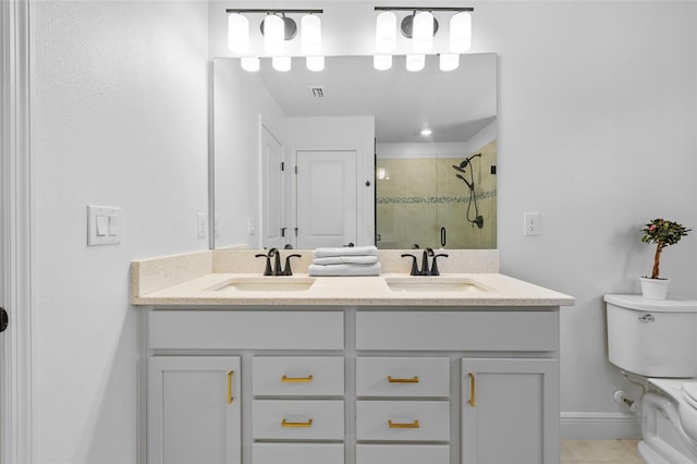 11430 Gallatin Trl, Parrish, FL 34219 - full bath with a shower stall, toilet, double vanity, tile patterned floors, and baseboards