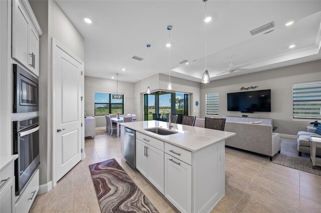 6244 Talon Preserve Dr, Nokomis, FL 34275 - kitchen with a sink, light countertops, stainless steel appliances, open floor plan, and baseboards