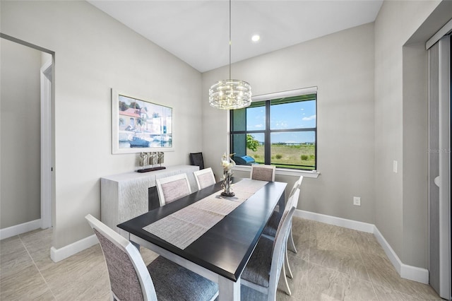 6244 Talon Preserve Dr, Nokomis, FL 34275 - dining space featuring light tile patterned floors, baseboards, and a chandelier