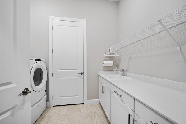 6244 Talon Preserve Dr, Nokomis, FL 34275 - laundry area with cabinet space, baseboards, washer / dryer, and a sink