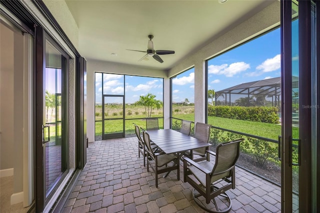 6244 Talon Preserve Dr, Nokomis, FL 34275 - sunroom / solarium featuring a ceiling fan and outdoor dining space