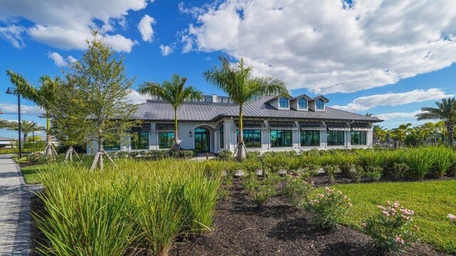 6244 Talon Preserve Dr, Nokomis, FL 34275 - rear view of house featuring metal roof