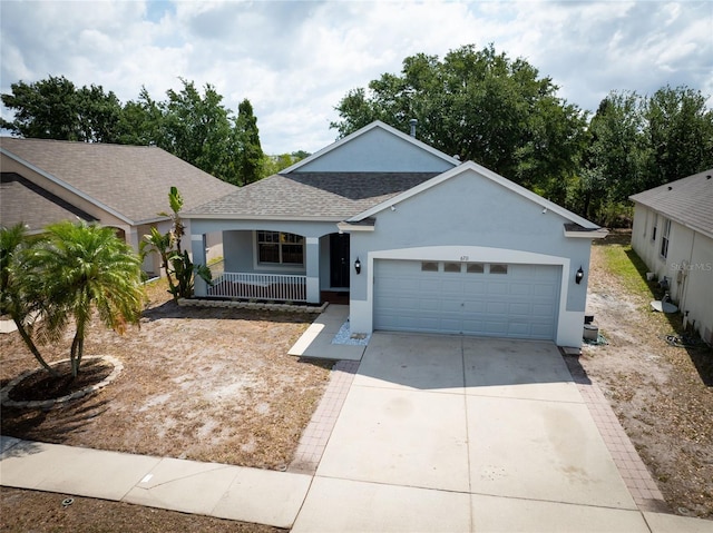 ranch-style home with a garage, stucco siding, a shingled roof, a porch, and driveway