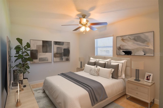 2402 16th St W, Palmetto, FL 34221 - bedroom with light tile patterned flooring, ceiling fan, and baseboards