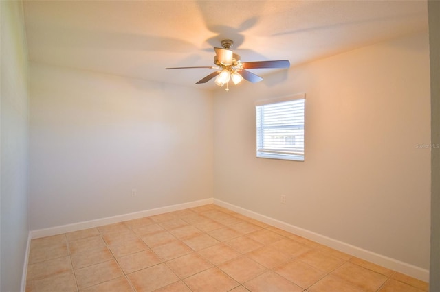 2402 16th St W, Palmetto, FL 34221 - empty room with ceiling fan, light tile patterned floors, and baseboards