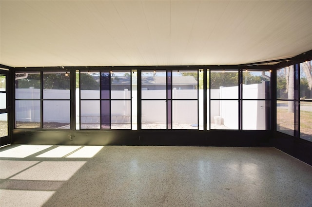 2402 16th St W, Palmetto, FL 34221 - unfurnished sunroom featuring speckle patterned floor and healthy amount of natural light