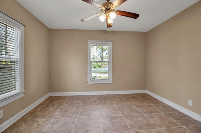 1830 Virginia Dr, Bradenton, FL 34205 - empty room with tile patterned flooring, baseboards, and ceiling fan