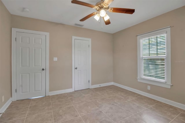 1830 Virginia Dr, Bradenton, FL 34205 - spare room with ceiling fan, baseboards, light tile patterned floors, and visible vents