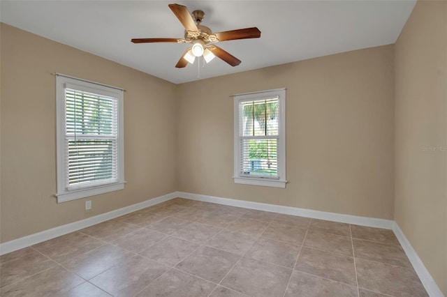 1830 Virginia Dr, Bradenton, FL 34205 - empty room featuring baseboards, a ceiling fan, and light tile patterned floors
