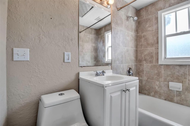 1830 Virginia Dr, Bradenton, FL 34205 - full bath featuring vanity, a textured wall, and plenty of natural light