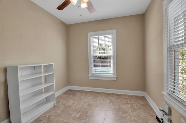1830 Virginia Dr, Bradenton, FL 34205 - unfurnished room with baseboards, a ceiling fan, and light tile patterned floors