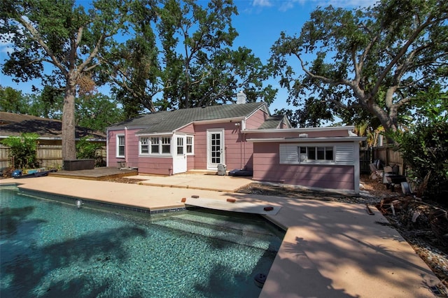 1830 Virginia Dr, Bradenton, FL 34205 - back of property with a fenced backyard, a patio area, and a fenced in pool