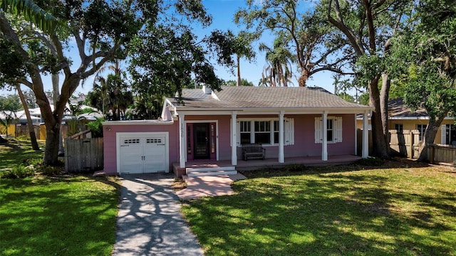 1830 Virginia Dr, Bradenton, FL 34205 - single story home featuring a front lawn, driveway, an attached garage, and fence