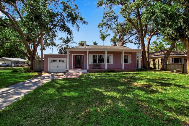 1830 Virginia Dr, Bradenton, FL 34205 - view of front of home with an attached garage, fence, a front lawn, a porch, and driveway
