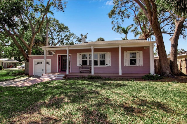 1830 Virginia Dr, Bradenton, FL 34205 - ranch-style home featuring covered porch, fence, an attached garage, and a front yard