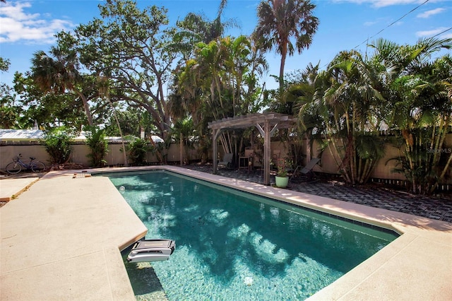 1830 Virginia Dr, Bradenton, FL 34205 - view of pool with a pergola, a fenced in pool, and a fenced backyard