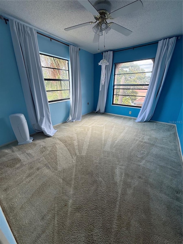 2808 60th Ave W Unit 1924, Bradenton, FL 34207 - carpeted spare room with a healthy amount of sunlight, ceiling fan, and a textured ceiling