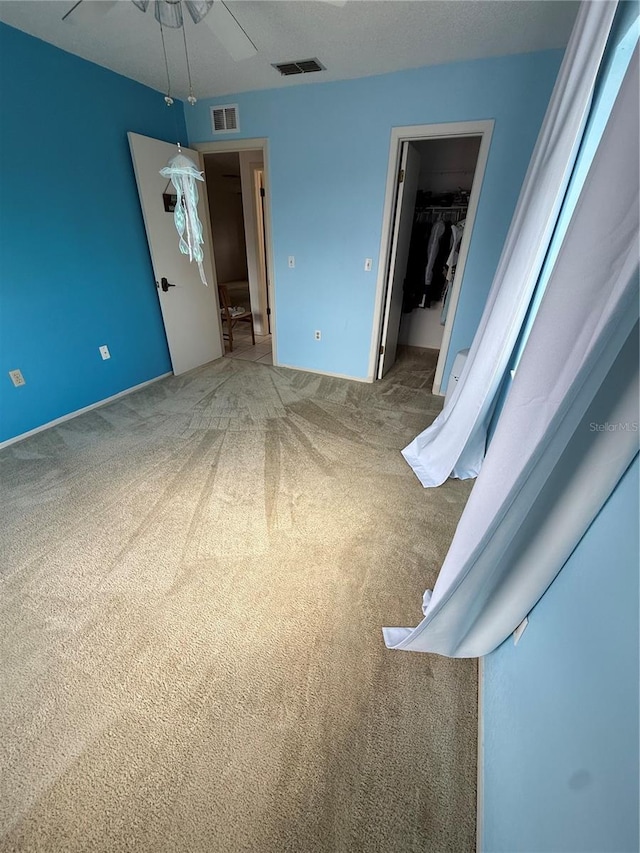 2808 60th Ave W Unit 1924, Bradenton, FL 34207 - unfurnished bedroom featuring a spacious closet, carpet flooring, and visible vents