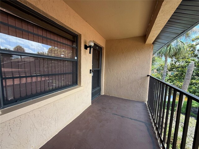 2808 60th Ave W Unit 1924, Bradenton, FL 34207 - entrance to property featuring stucco siding and a balcony