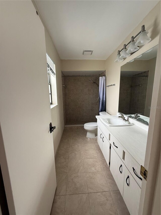 2808 60th Ave W Unit 1924, Bradenton, FL 34207 - full bathroom with toilet, vanity, tiled shower, and tile patterned floors