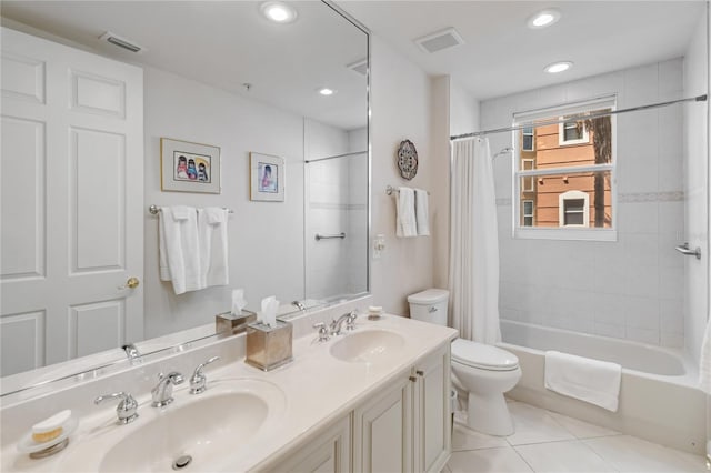 bathroom featuring toilet, tile patterned flooring, shower / bath combination with curtain, double vanity, and recessed lighting
