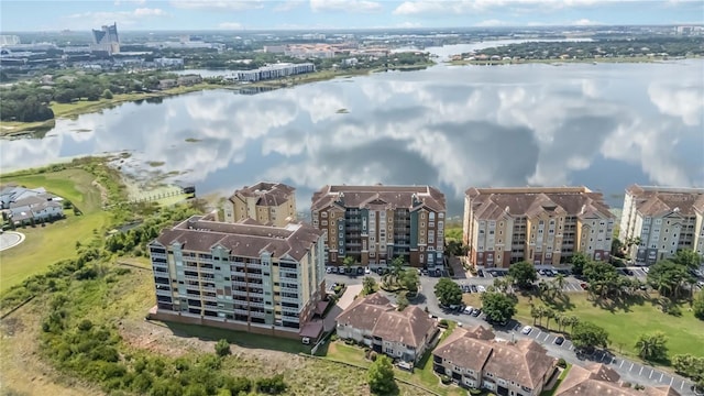 drone / aerial view of a large body of water and apartment complex