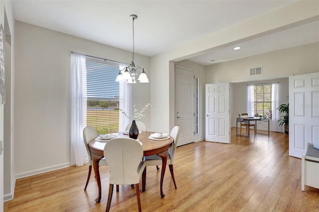 dining room with a chandelier, light wood-style flooring, recessed lighting, baseboards, and visible vents