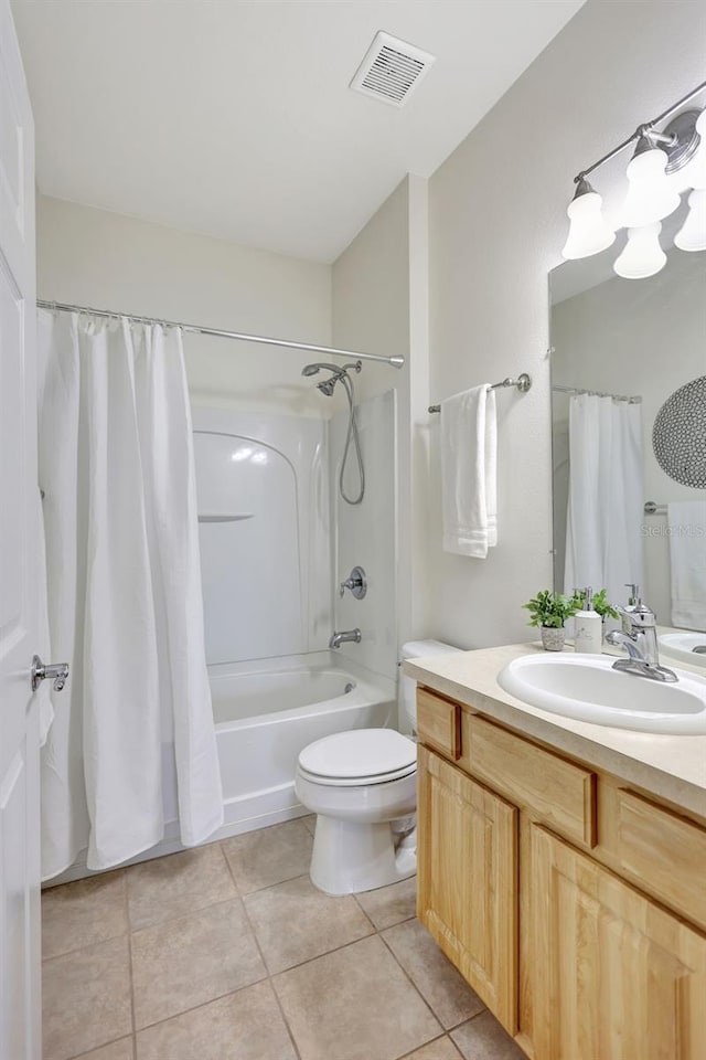 full bathroom with visible vents, tile patterned floors, vanity, toilet, and shower / tub combo with curtain